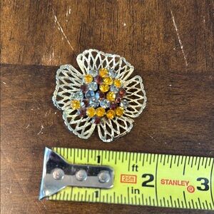 Silver and Yellow Floral Brooch with Intricate Metalwork Brooch pin